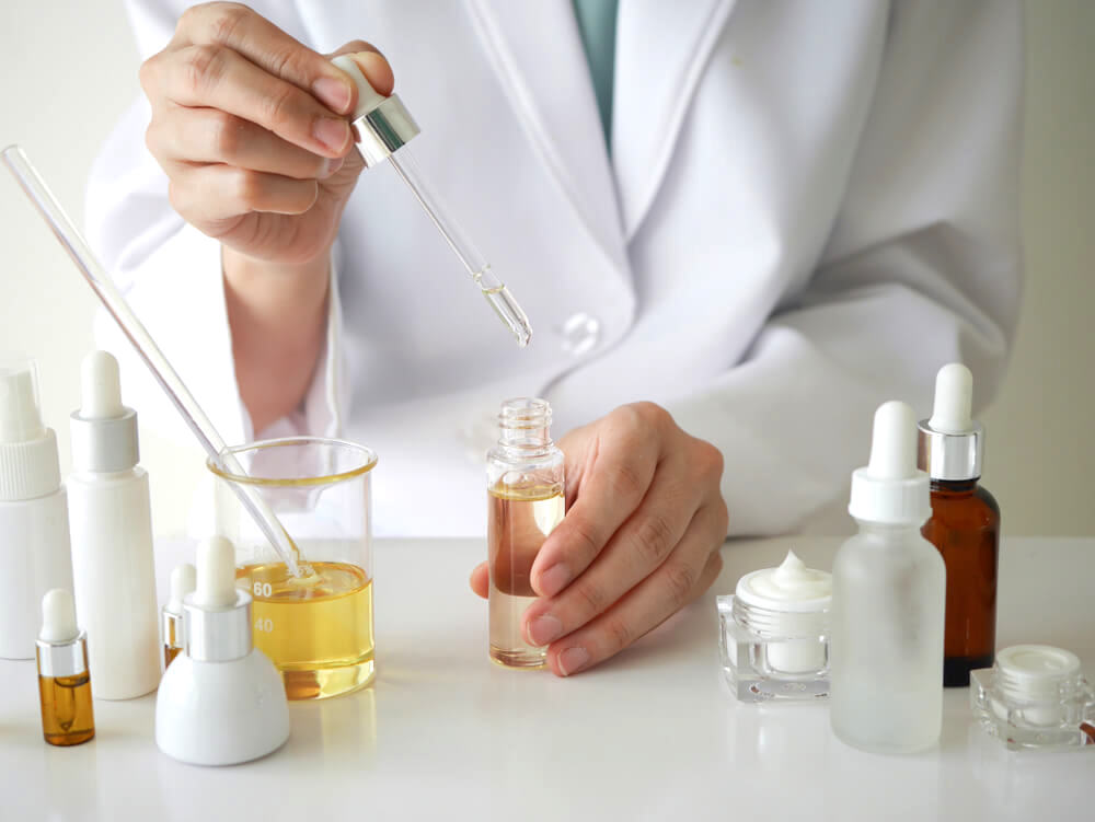 Scientist in lab creating private label cosmetics