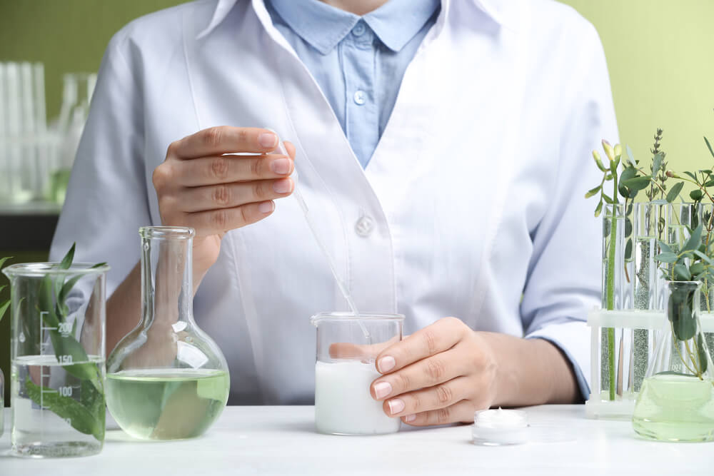 Scientist working on formula in lab