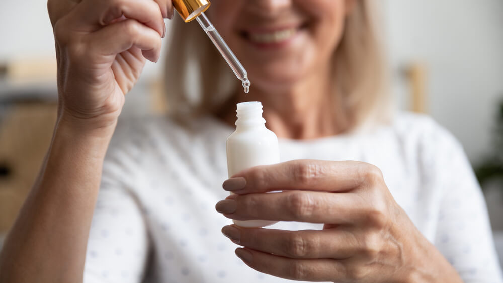 Woman using serum