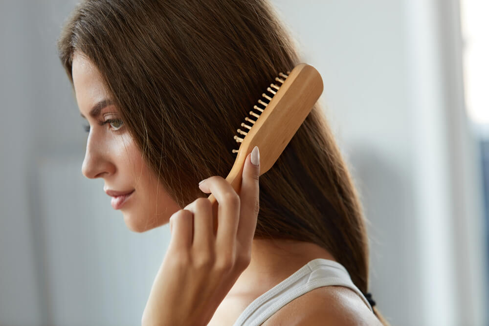 Woman brushing hair