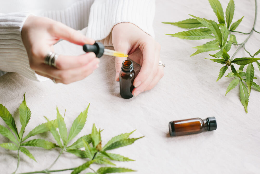 Woman using CBD products