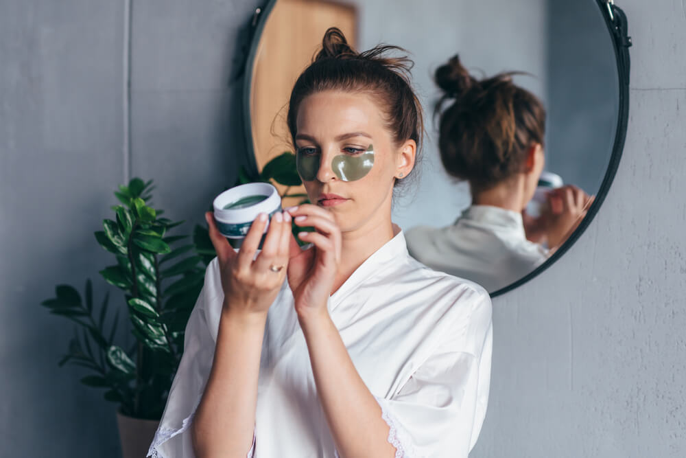 Woman looking at beauty product label