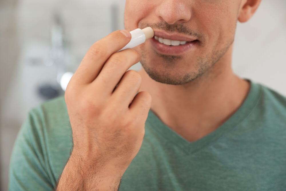 Man using lip balm