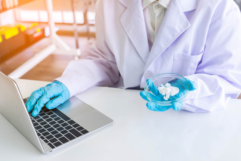 white coat on laptop