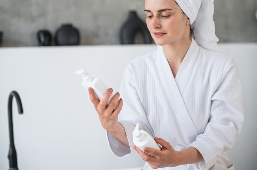 woman looking at skincare