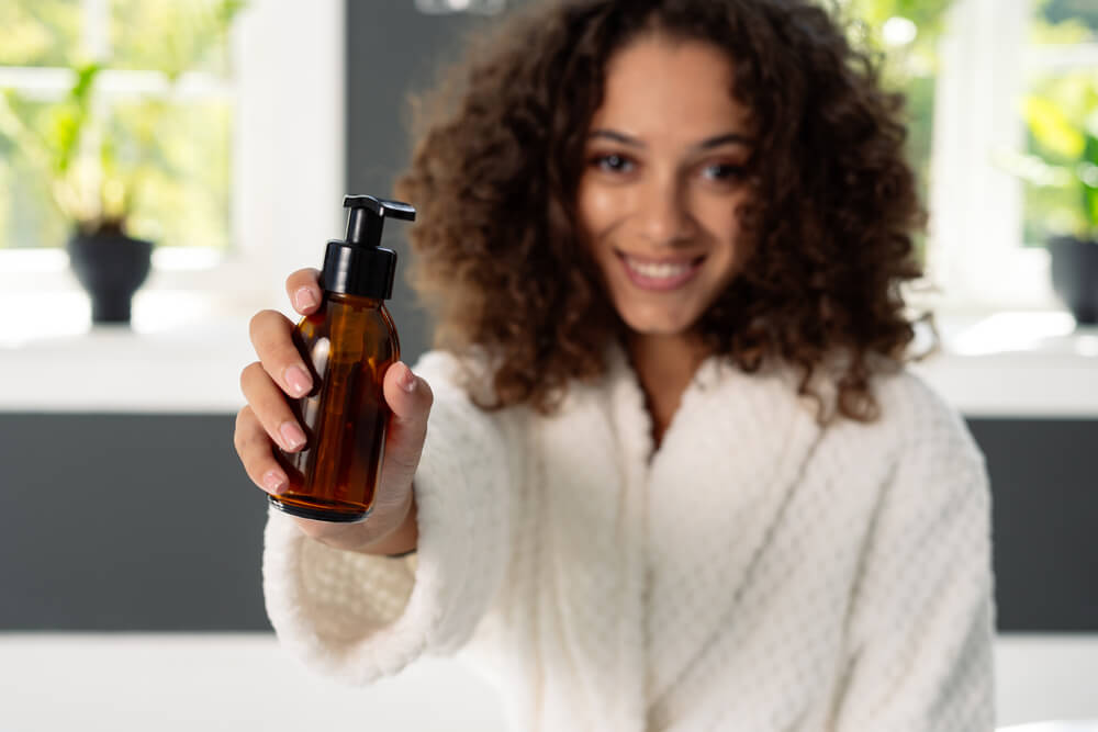 woman holding skincare