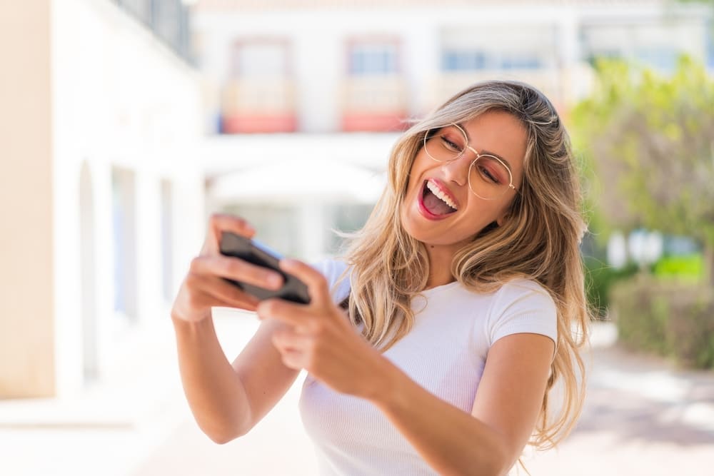 Woman playing games on her phone
